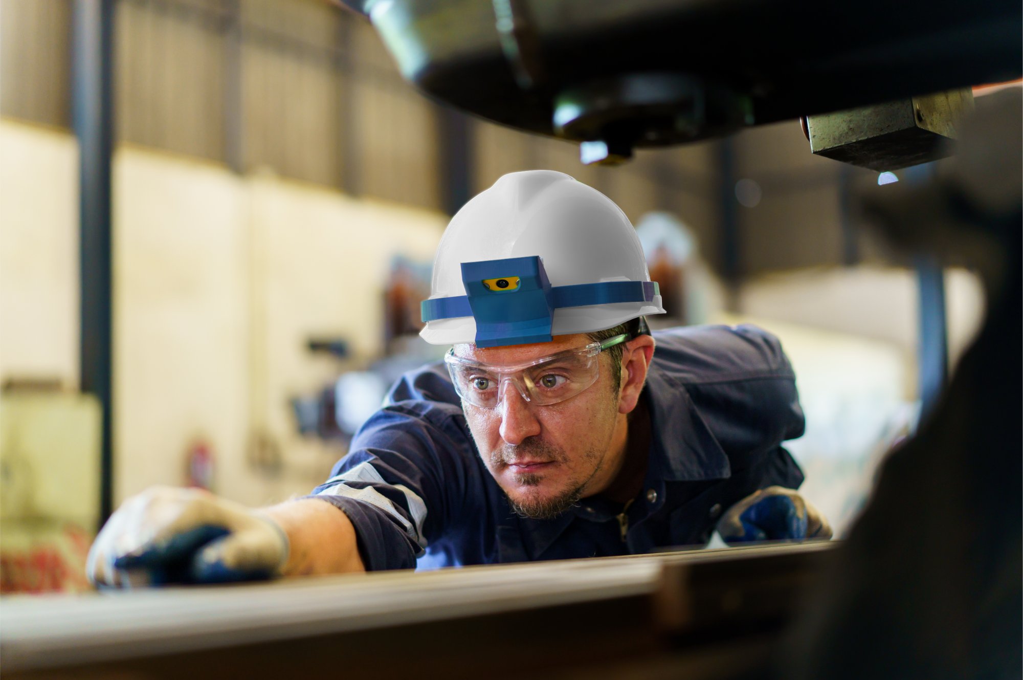 Operator inspecting a part on the line, wearing a SiteVue-equipped hard hat